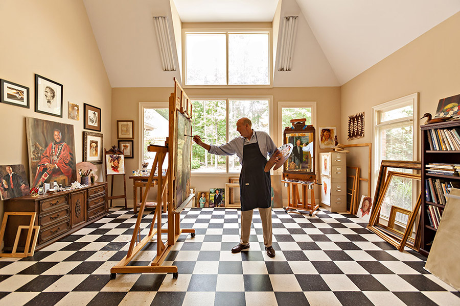 Jamie painting a portriat in his studio